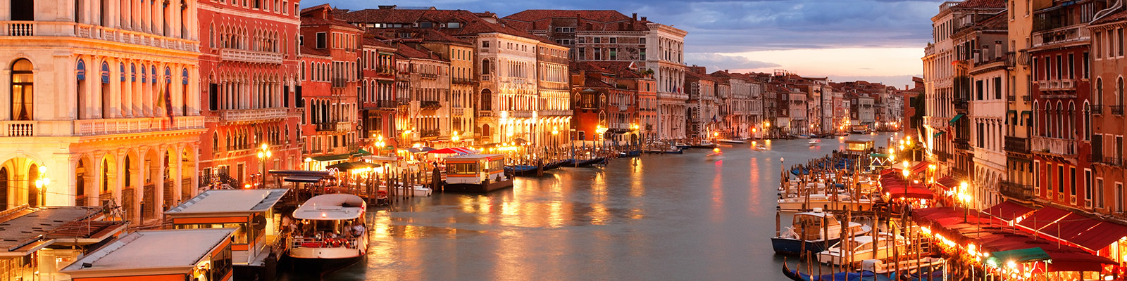The Venice canals lit up at dusk
